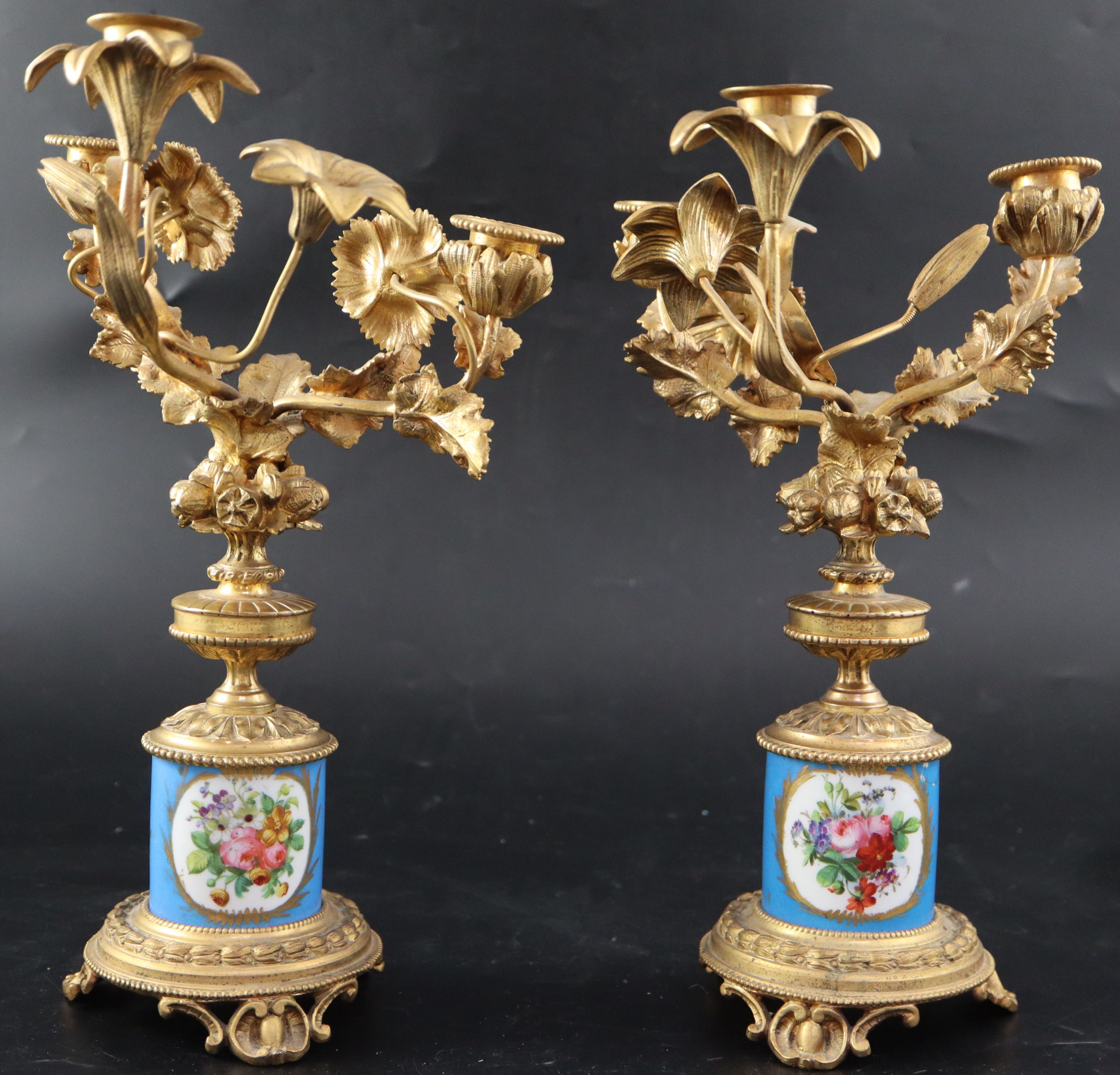 A pair of 19th century French ormolu and Sevres style porcelain three light candelabra, height 32cm